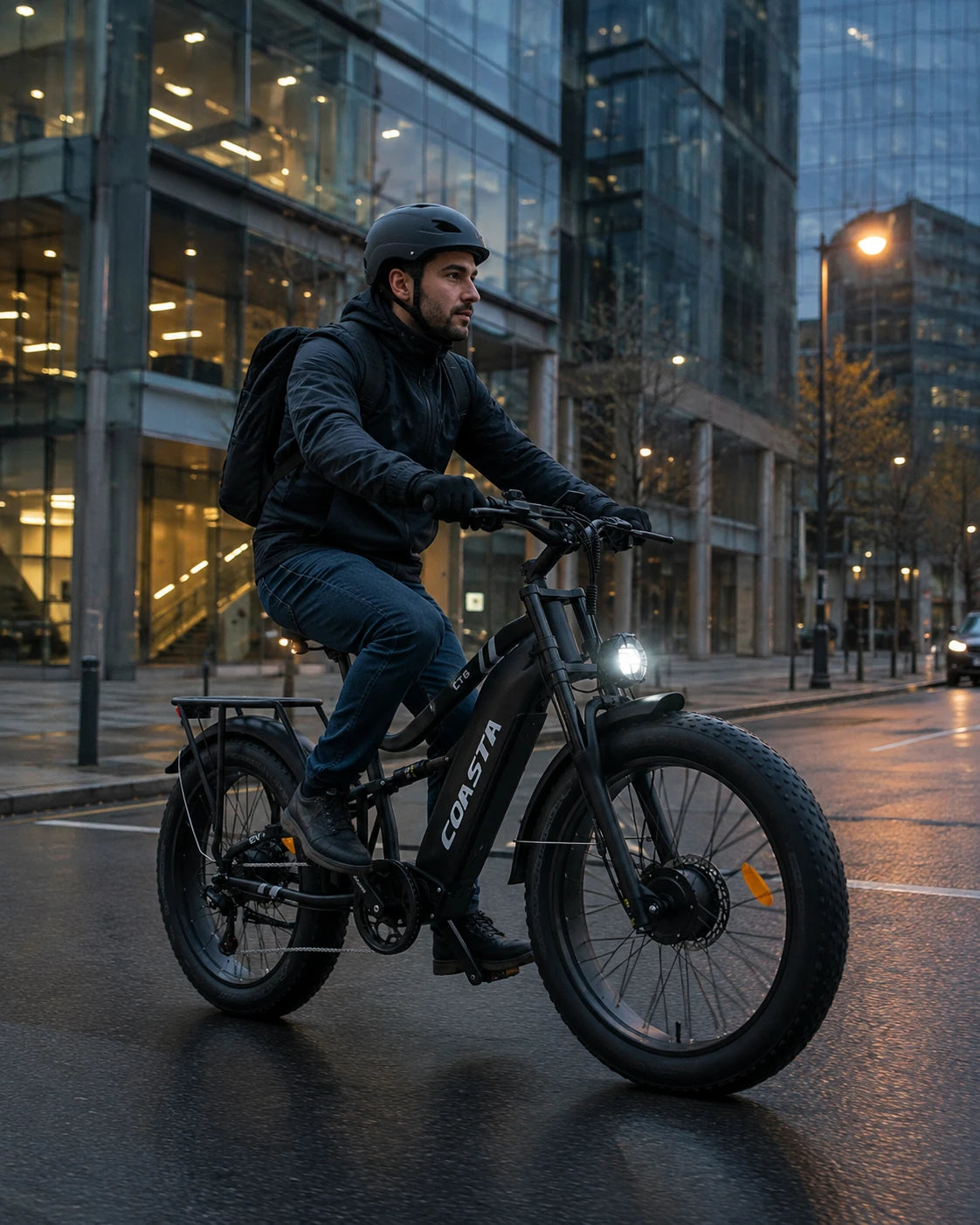 COASTA CT6 rider commuting through the city at blue hour